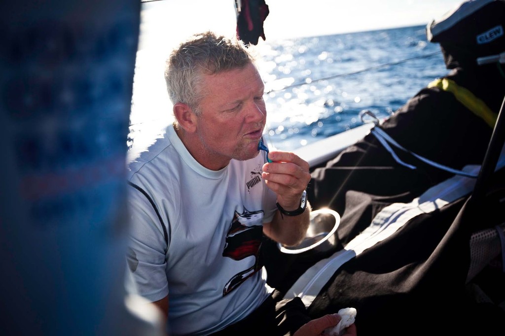 Tony Mutter going for a shave. PUMA Ocean Racing powered by BERG during Leg 1 of the Volvo Ocean Race 2011-12 © Amory Ross/Puma Ocean Racing/Volvo Ocean Race http://www.puma.com/sailing
